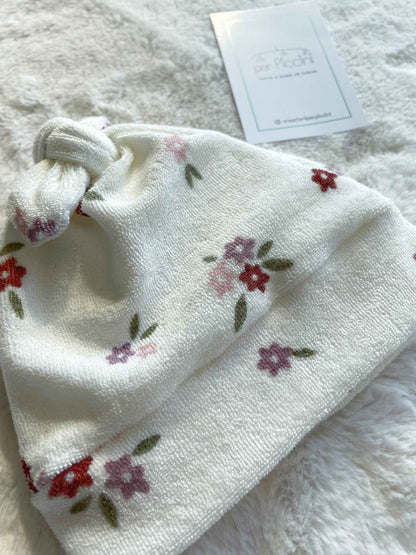 Cappellino neonato con nodo in spugna fantasia fiori